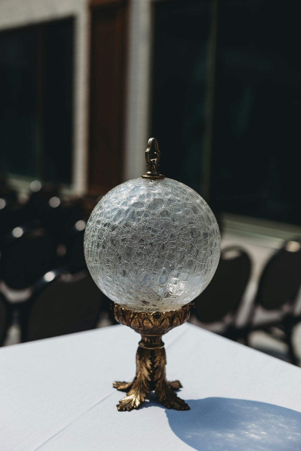 a glass ball on top of a white table