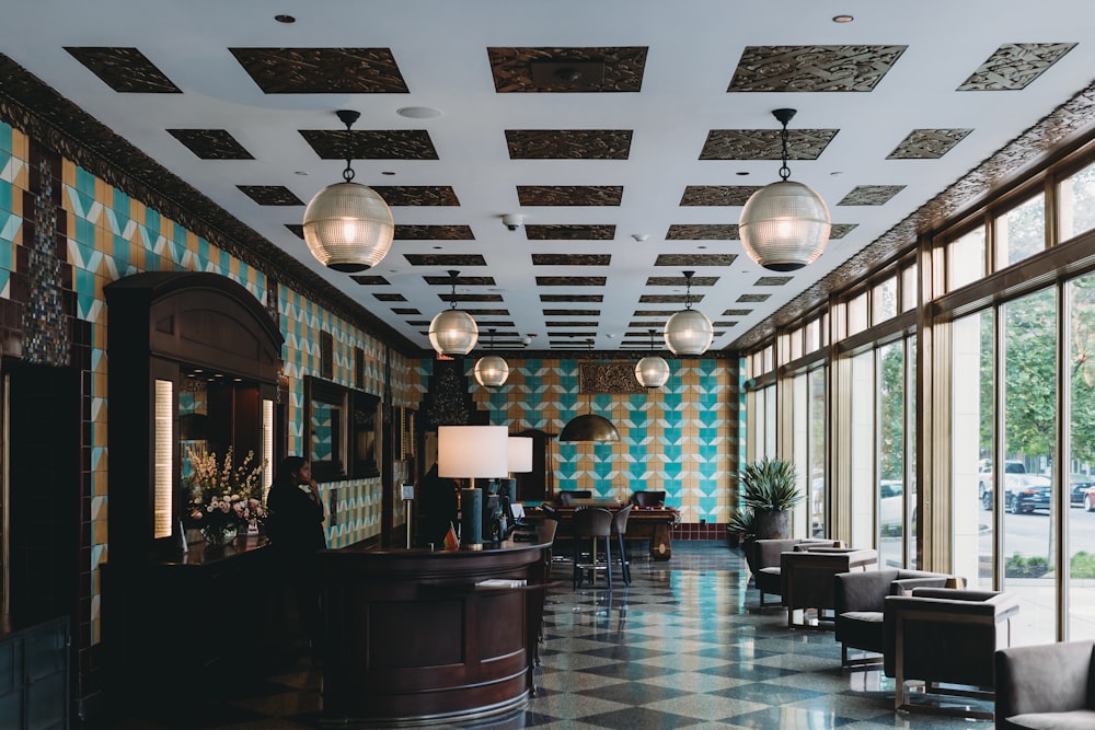 a room with a checkered floor and a bar