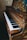 A piano with ornate, artistic designs on its exterior, including painted scenes and decorations. The piano keys alternate between white and black, and the frame has a rich, antique look. The artwork includes depictions of nature, human figures, and intricate patterns.