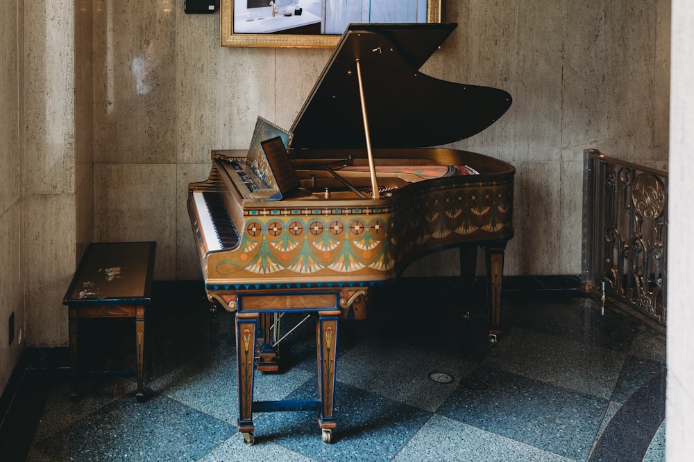 a grand piano sitting in a room next to a mirror