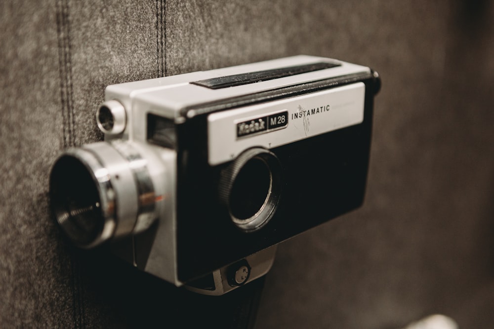 a camera mounted to the side of a couch