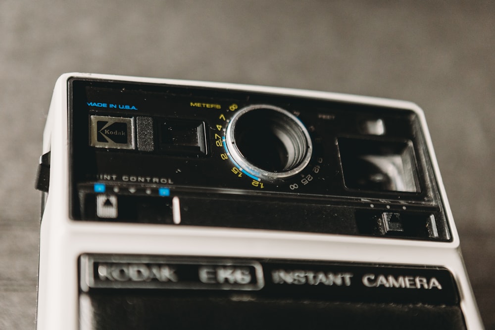 an old camera sitting on top of a table