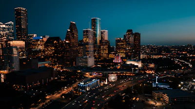 a view of a city at night from the top of a building