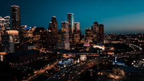 a view of a city at night from the top of a building