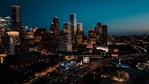 a view of a city at night from the top of a building