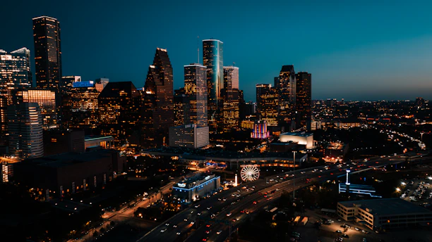 a view of a city at night from the top of a building