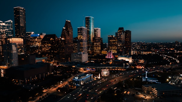a view of a city at night from the top of a building