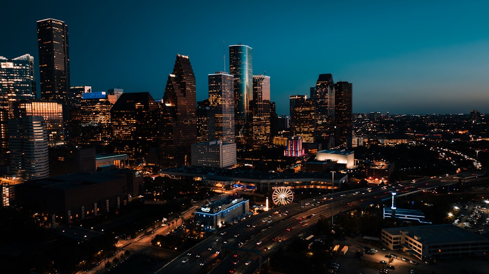 a view of a city at night from the top of a building