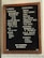 A stylish coffee shop menu board with a wooden frame features a variety of drink options. The left column lists 'Classics' including espresso with choices of water or milk, filter coffee, cold brew, pour-over, and tea. Various milk alternatives are also offered, such as whole, almond, and oat. The right column presents 'Signatures' like mocha, tres leches, chai, matcha, and hot cocoa, along with unique options such as Bermuda, Triangle, Cold Brew Horchata, and assorted syrups. The board also displays the WiFi password: Methodical.