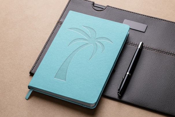 Soft lila and turquoise custom notebooks with rounded edges and elegant handwriting fonts