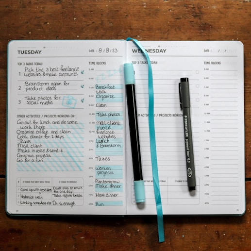 a notepad with a pen and a pen on top of it