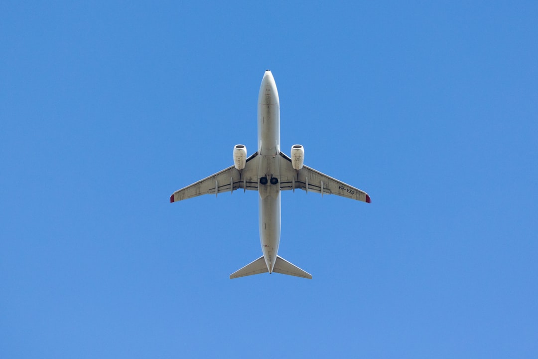 a large jetliner flying through a blue sky, Qantas - Boeing 737 - VH-VXQ