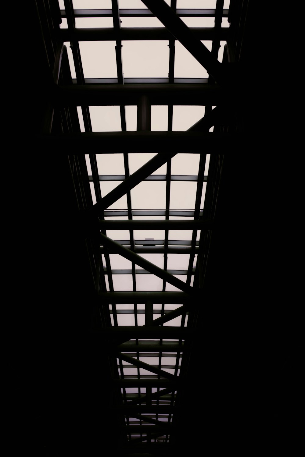 a black and white photo of a train platform