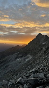 A vivid outdoor scene showing golden hour light over a mountain landscape filmed for a visual project.