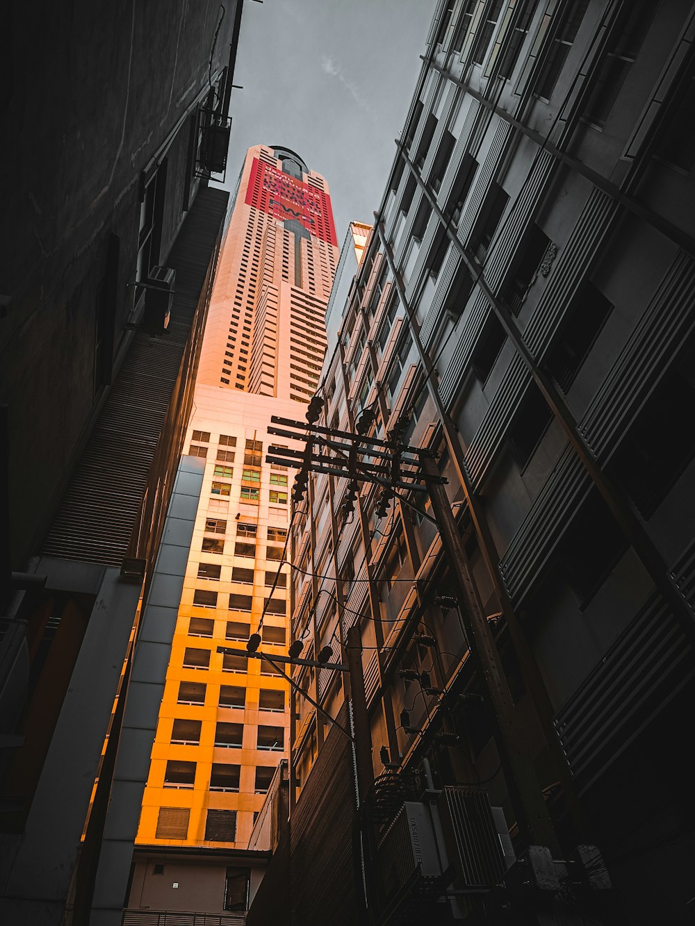 a tall building with a red sign on it's side