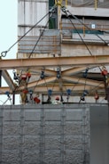 a crane is attached to the side of a building