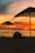 A couple dining at sunset on the beach at Nustyak.