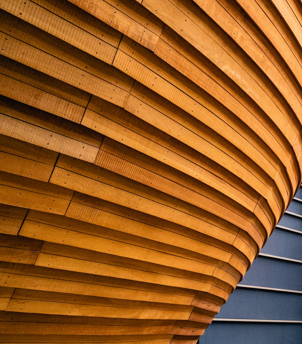 a close up of a wooden structure with a clock on it