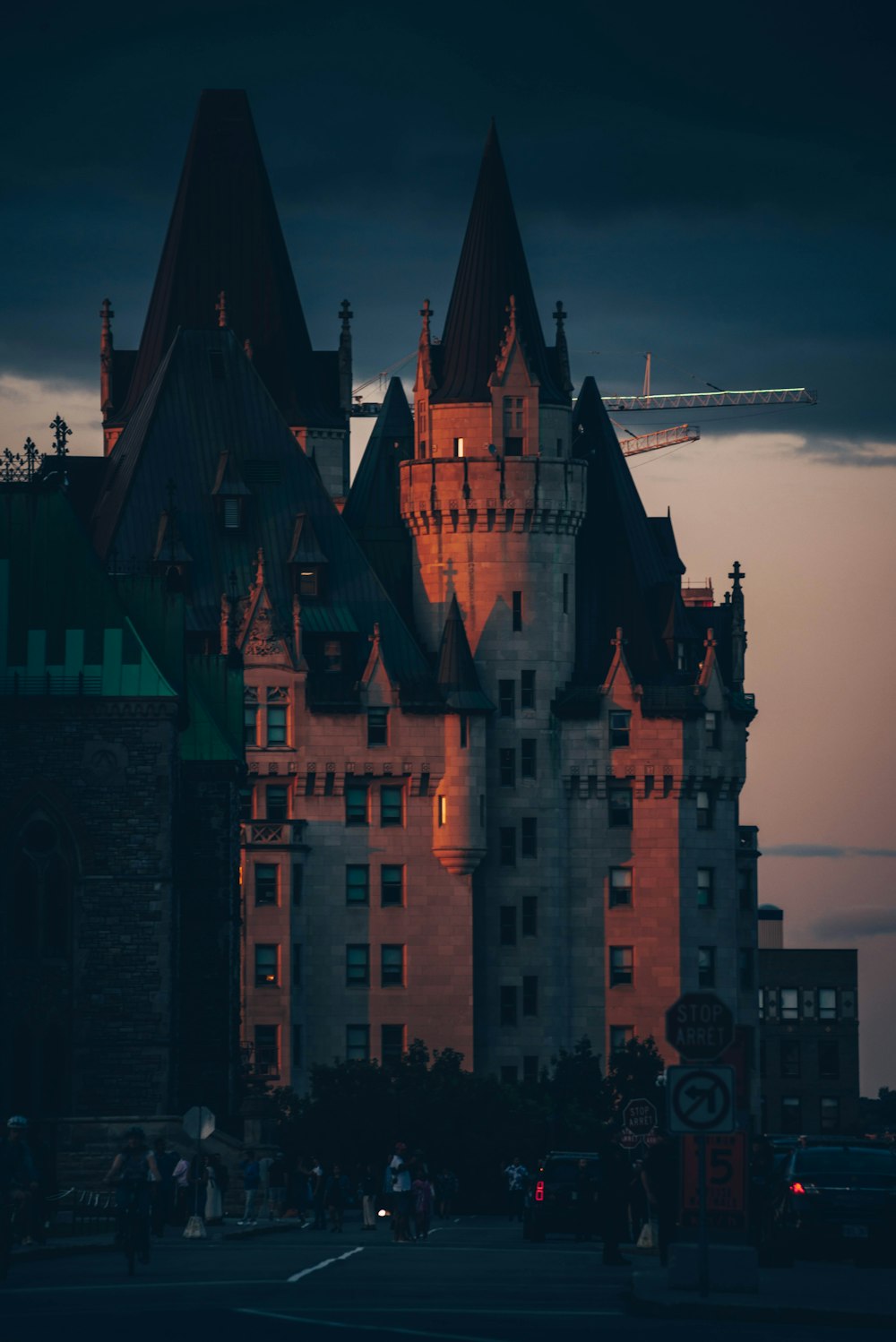 a large castle with a plane flying over it