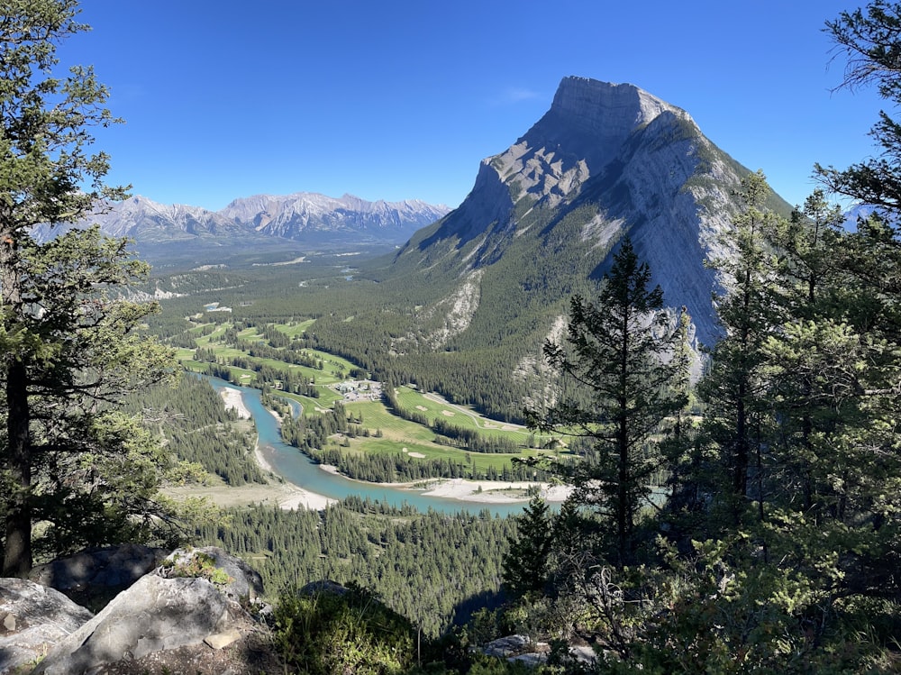 a view of a valley with a river running through it