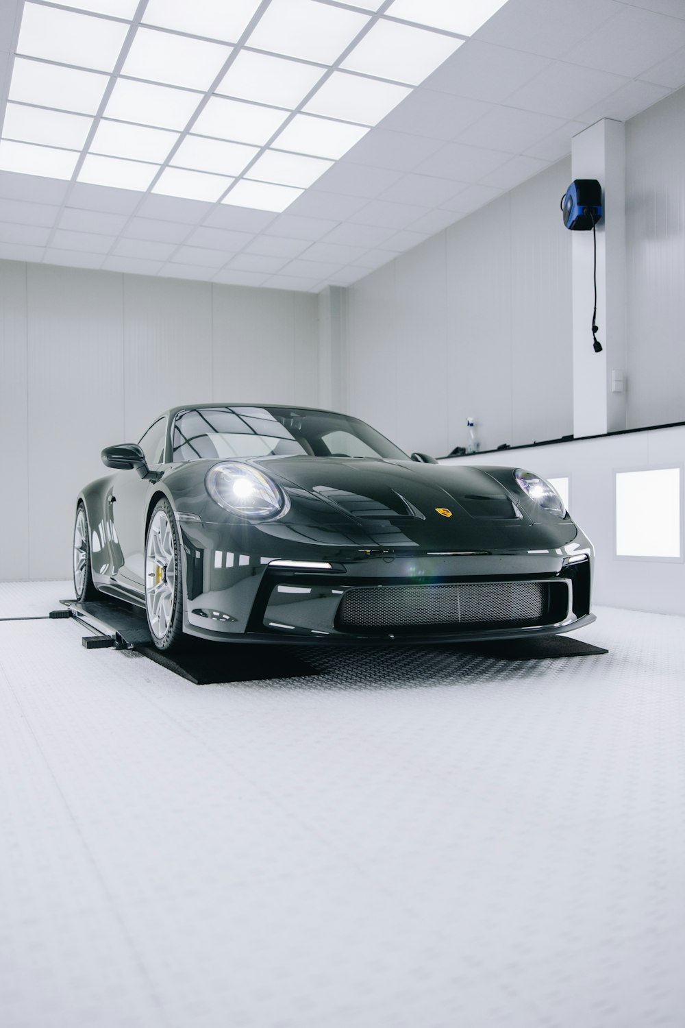 a black sports car parked in a garage