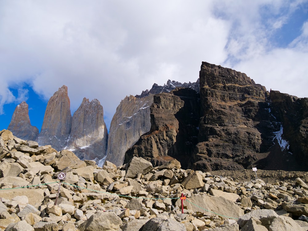 a man standing on top of a pile of rocks