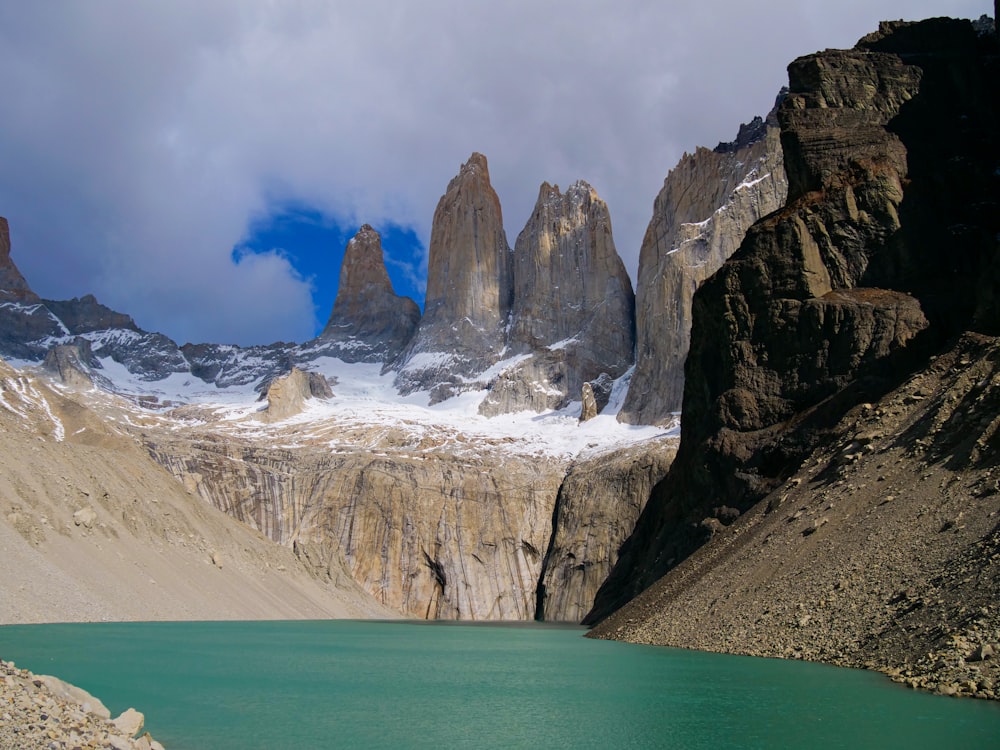 a mountain range with a body of water in front of it