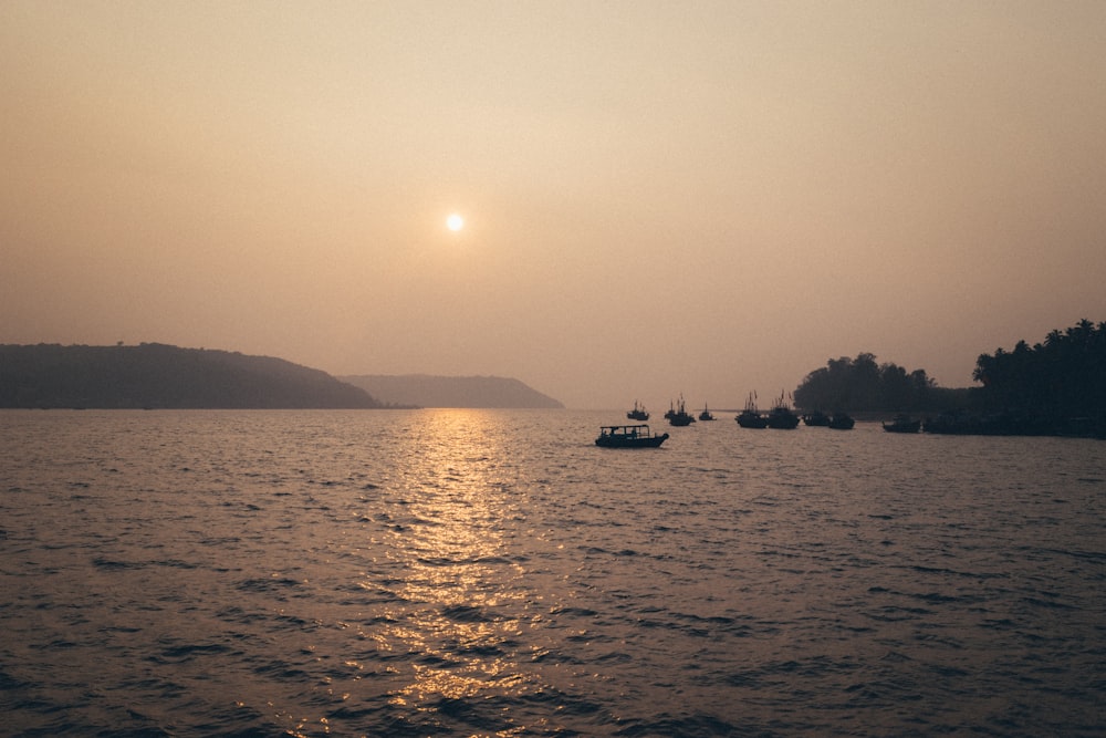 a body of water with boats floating on top of it