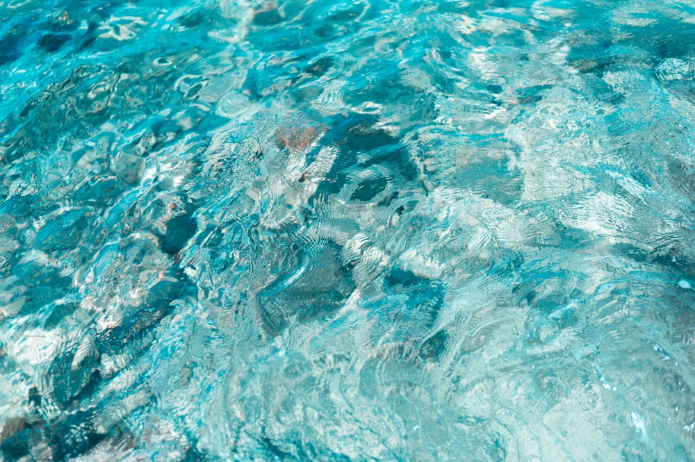 a close up of a pool with clear blue water