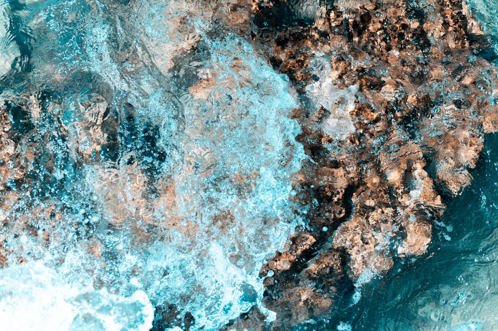 an aerial view of a rock formation in the ocean