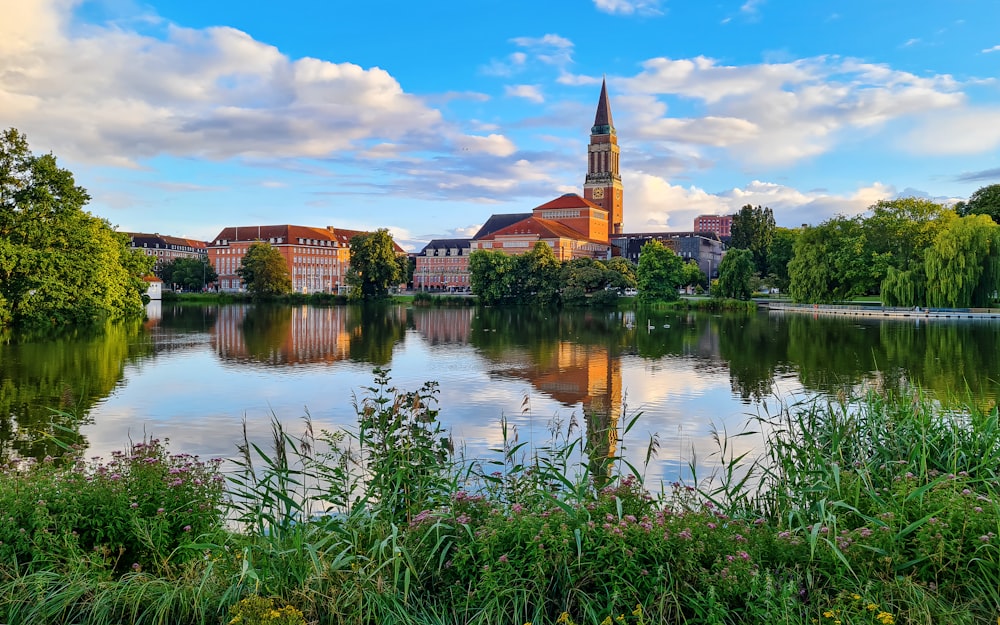 a lake with a church in the background