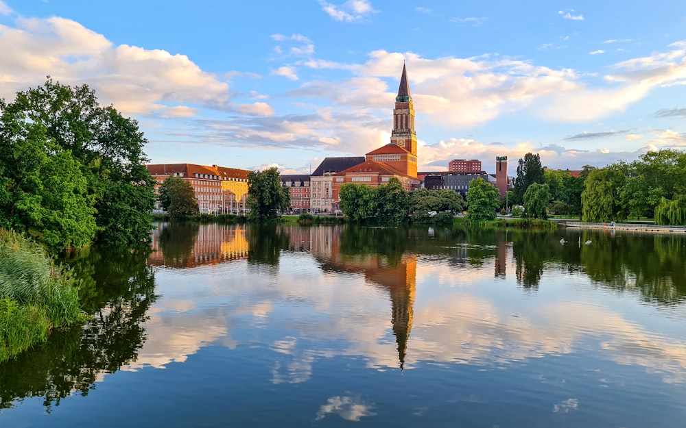 a large body of water with a church in the background