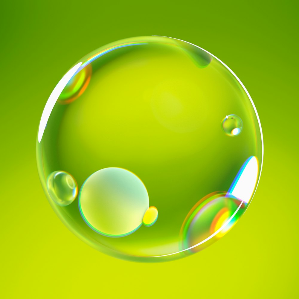 a soap bubble floating on a green background