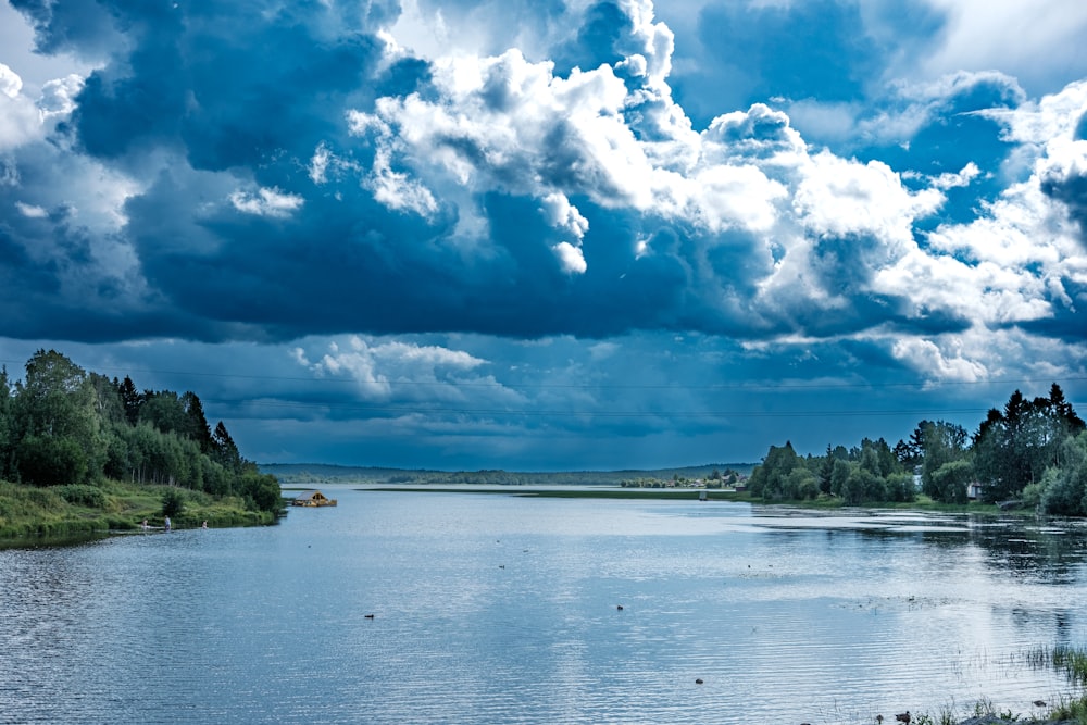 a large body of water surrounded by trees