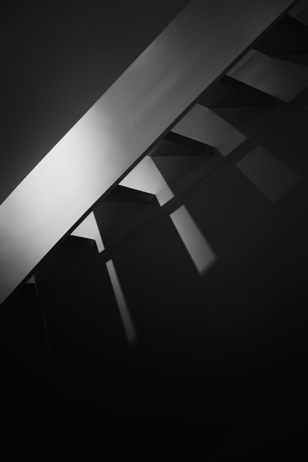 a black and white photo of a staircase