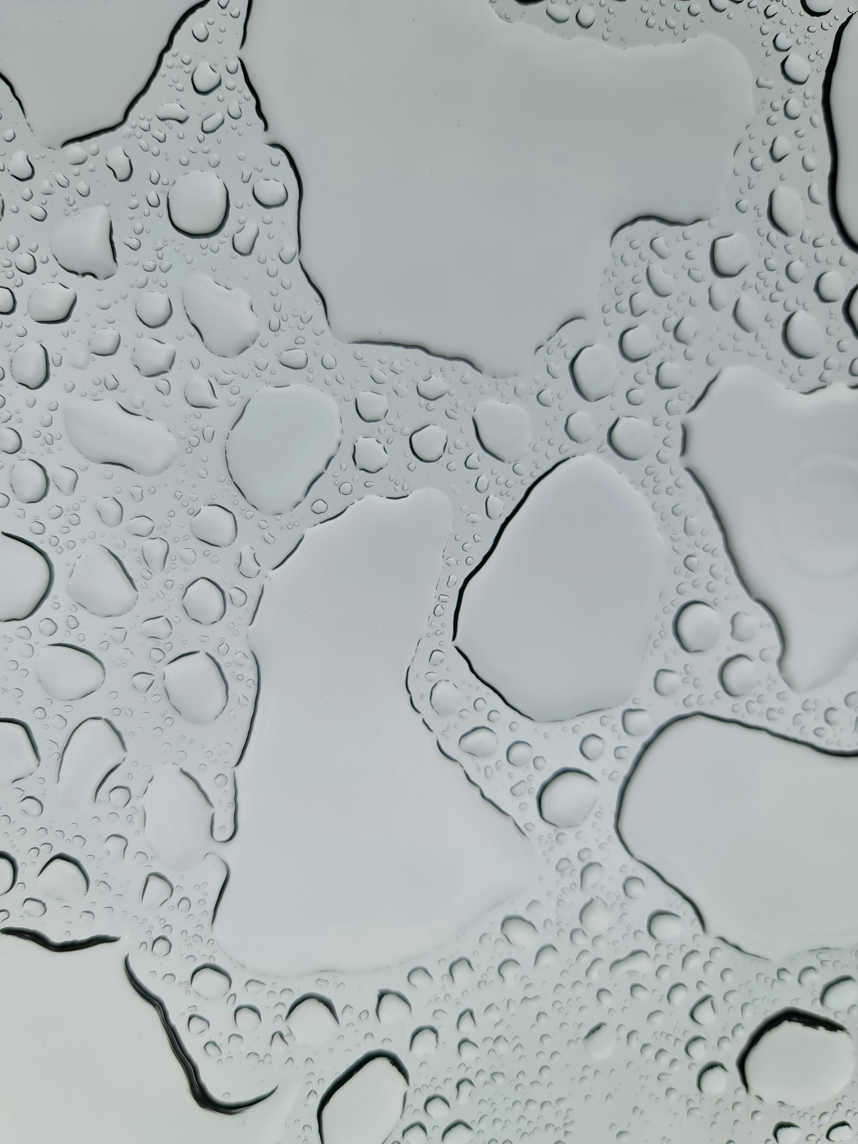 a close up of water droplets on a surface