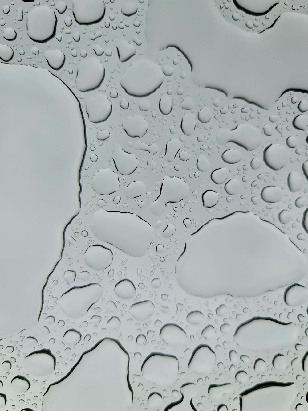 a close up of water droplets on a surface