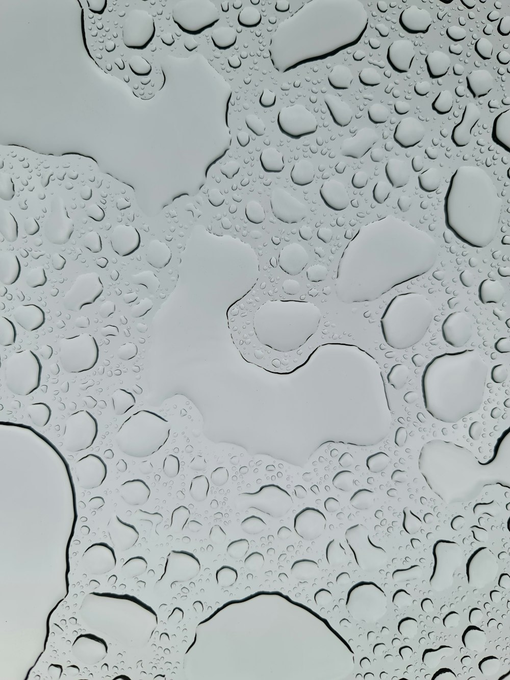 a close up of water droplets on a surface