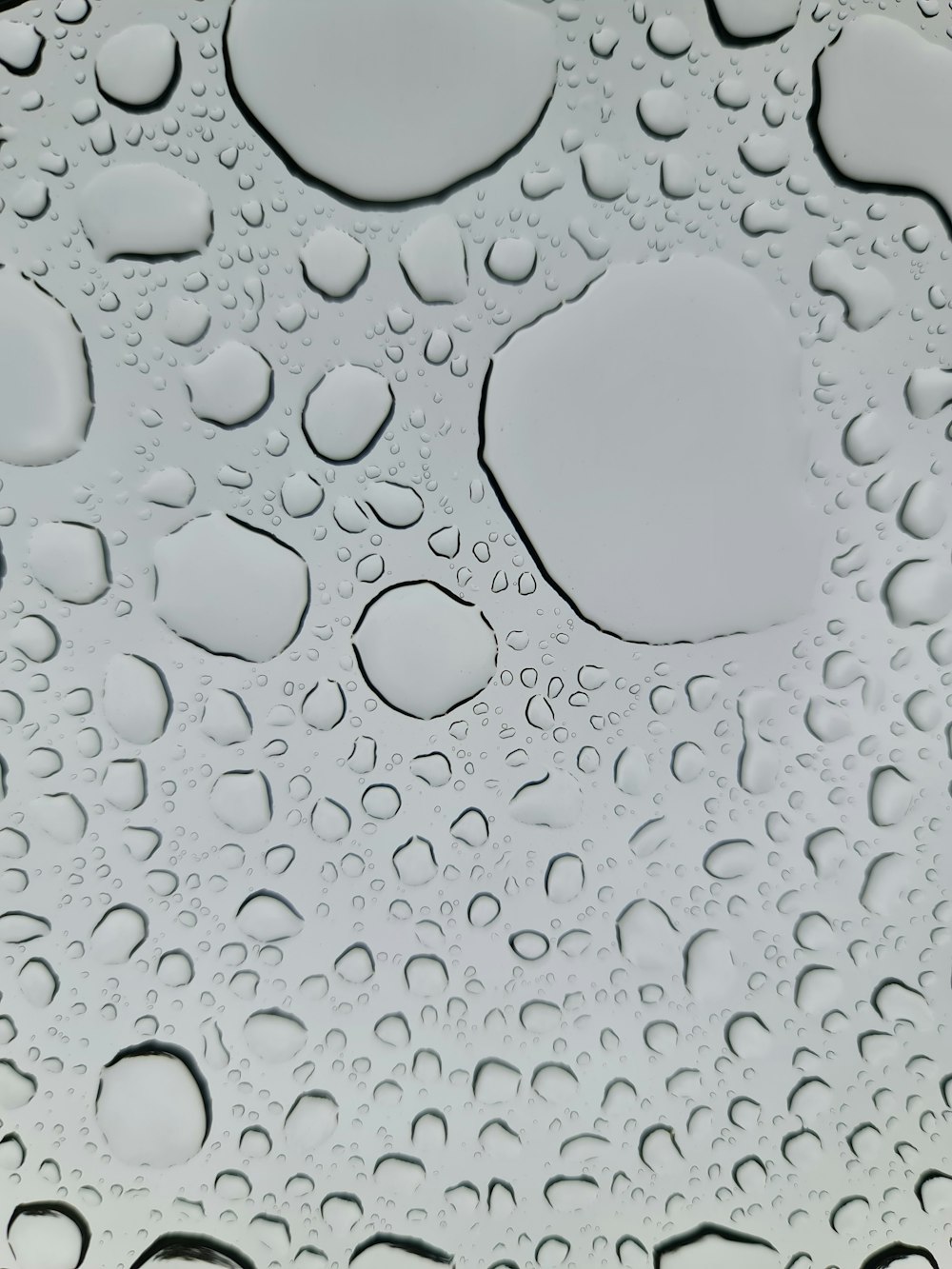 a close up of water droplets on a surface