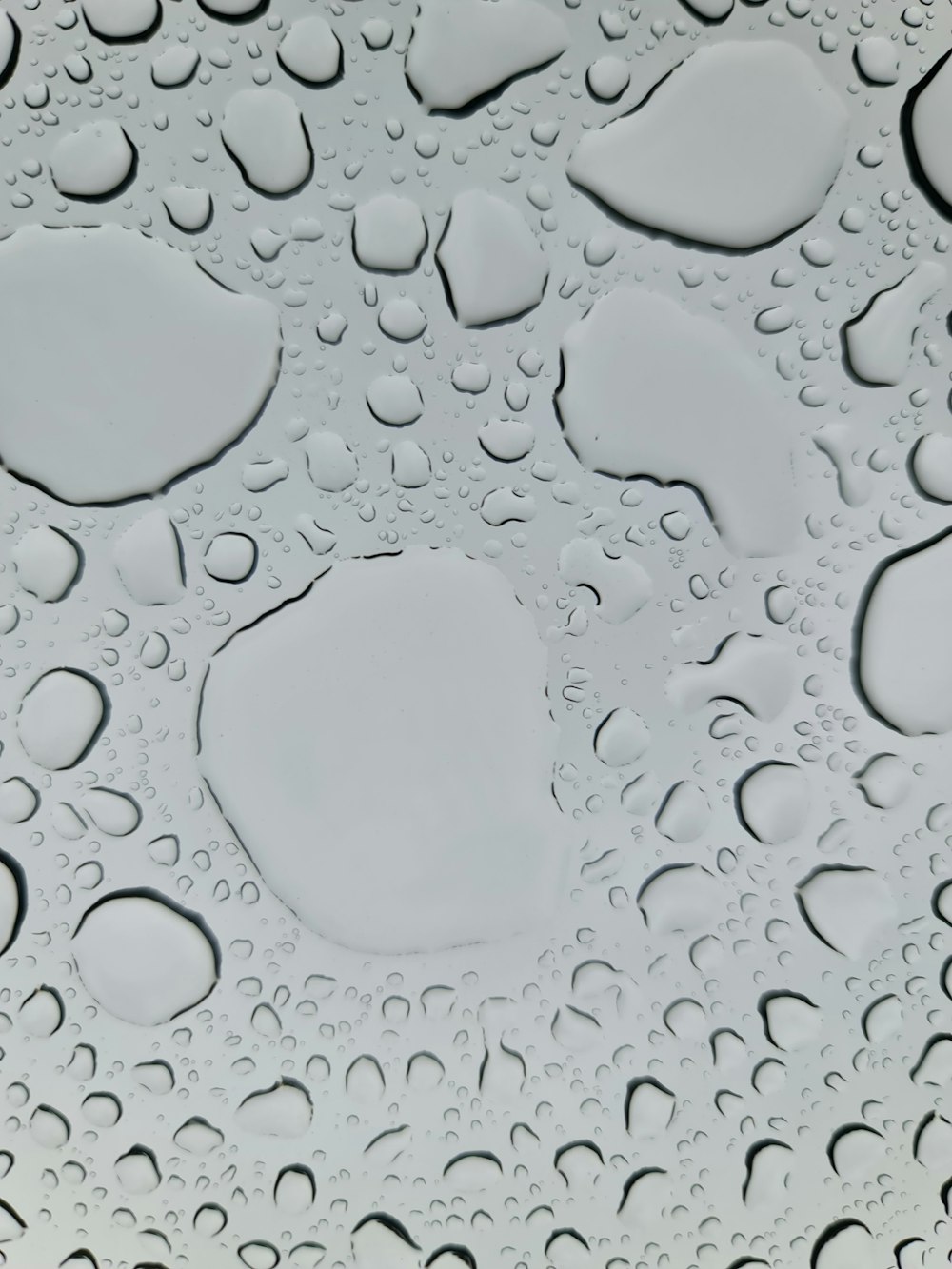 a close up of water droplets on a surface