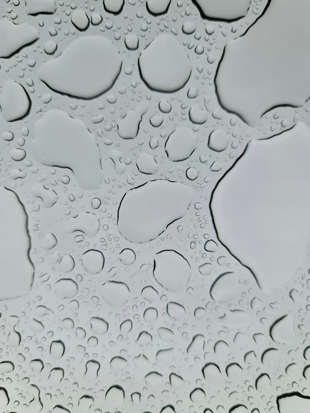 a close up of water droplets on a surface