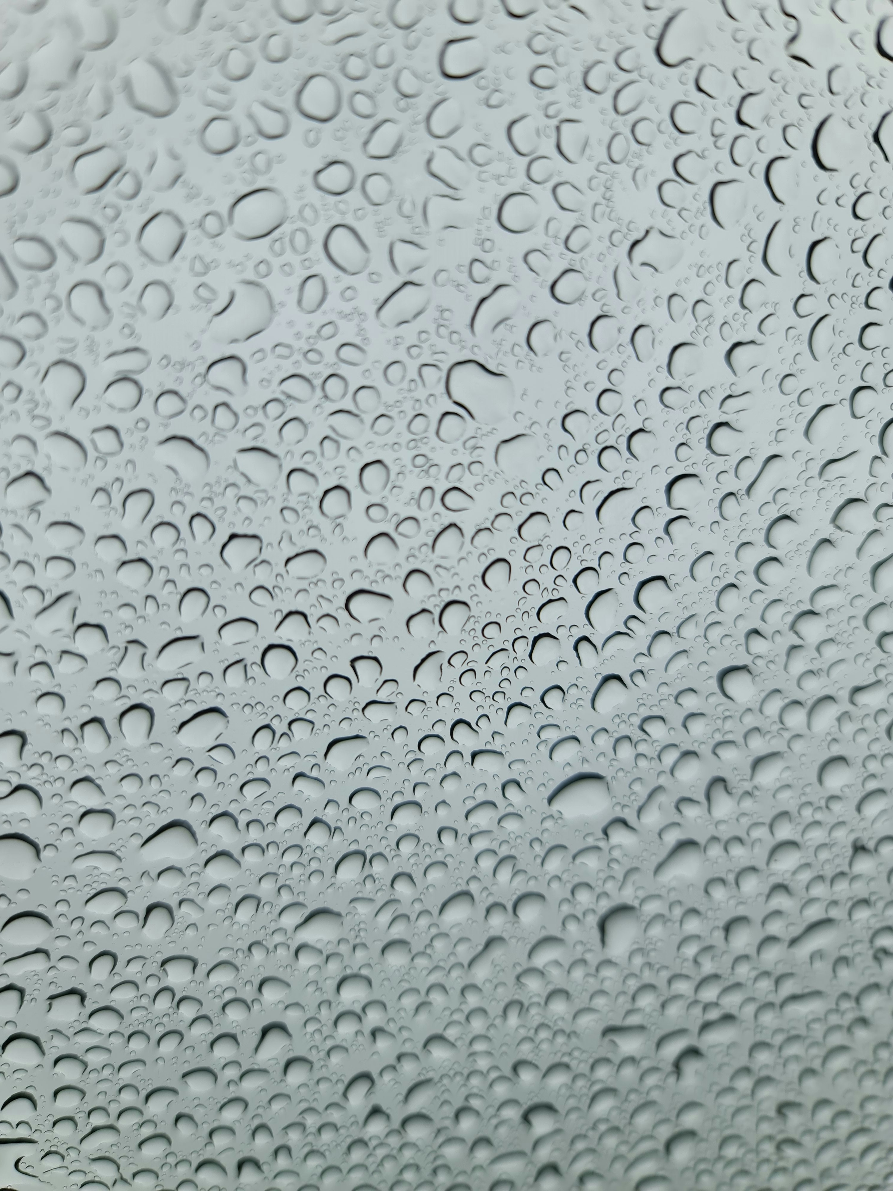 a close up of a rain covered window