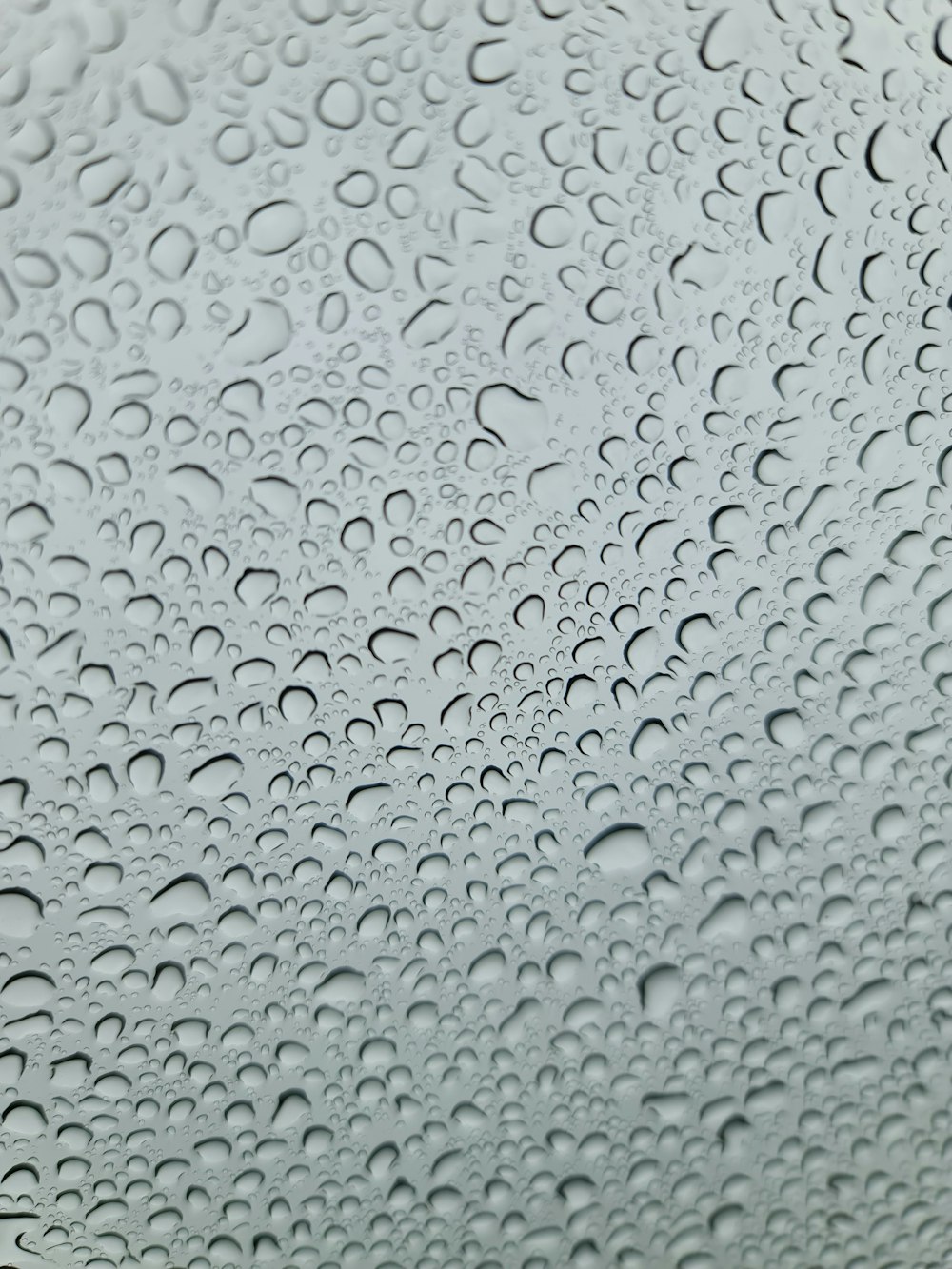 a close up of a rain covered window