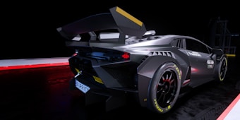A sleek, futuristic sports car with a dark metallic finish is prominently displayed against a dimly lit background. The car features an aggressive aerodynamic design with sharp angles and a large rear spoiler. Racing decals and intricate detailing, including a visible license plate, adorn the vehicle. The lighting highlights the contours and fine details of the car&rsquo;s construction.