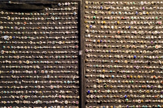 Shiny nose rings in different American style colors, neatly organized.