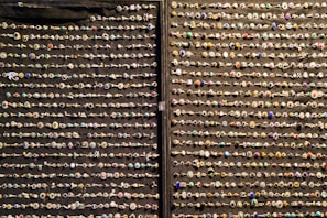 Shiny nose rings in different American style colors, neatly organized.
