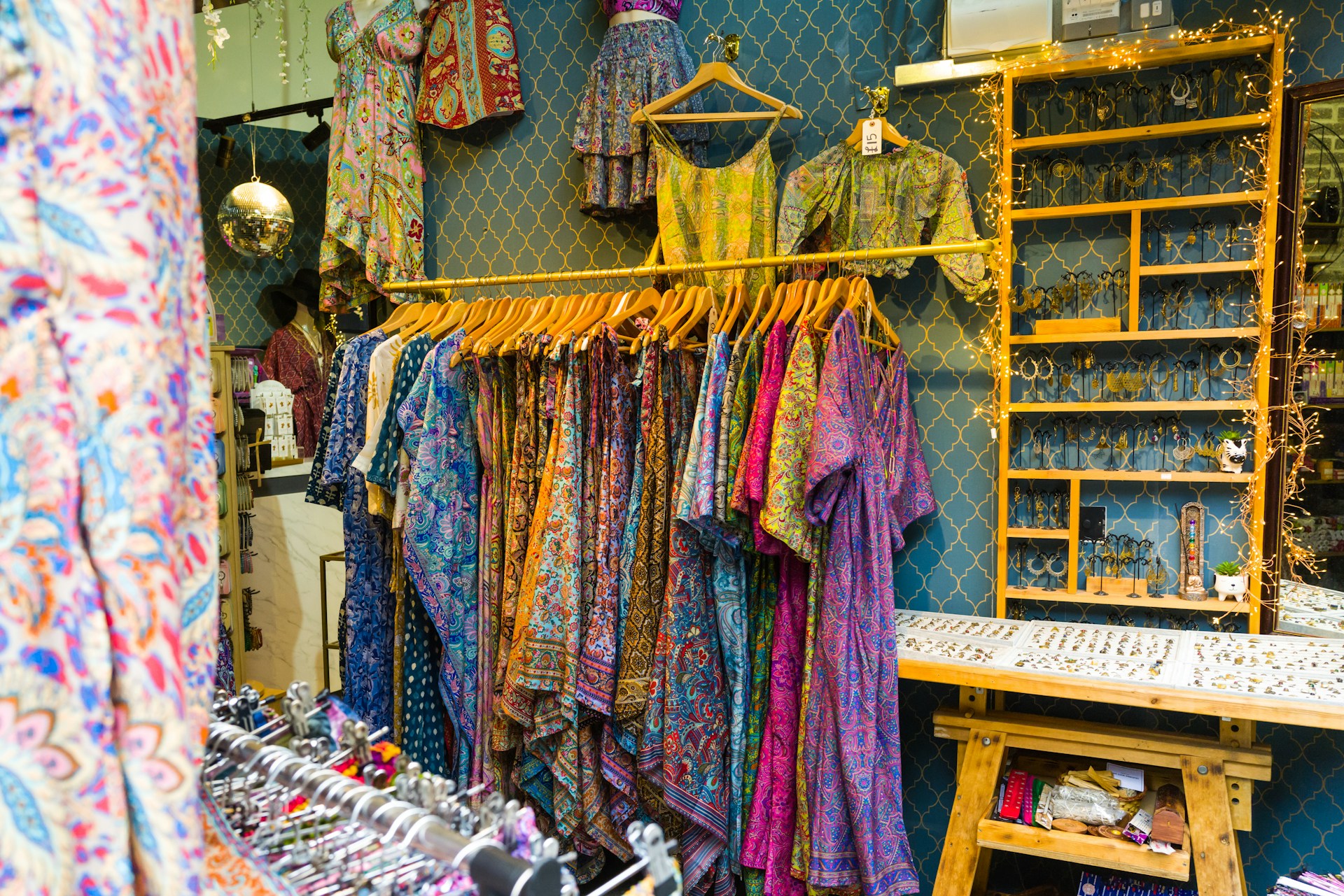 a store with a variety of colorful clothing on display