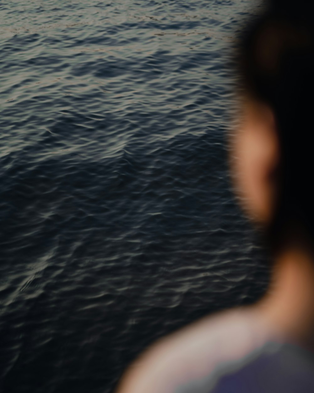 a person looking at a boat in the water