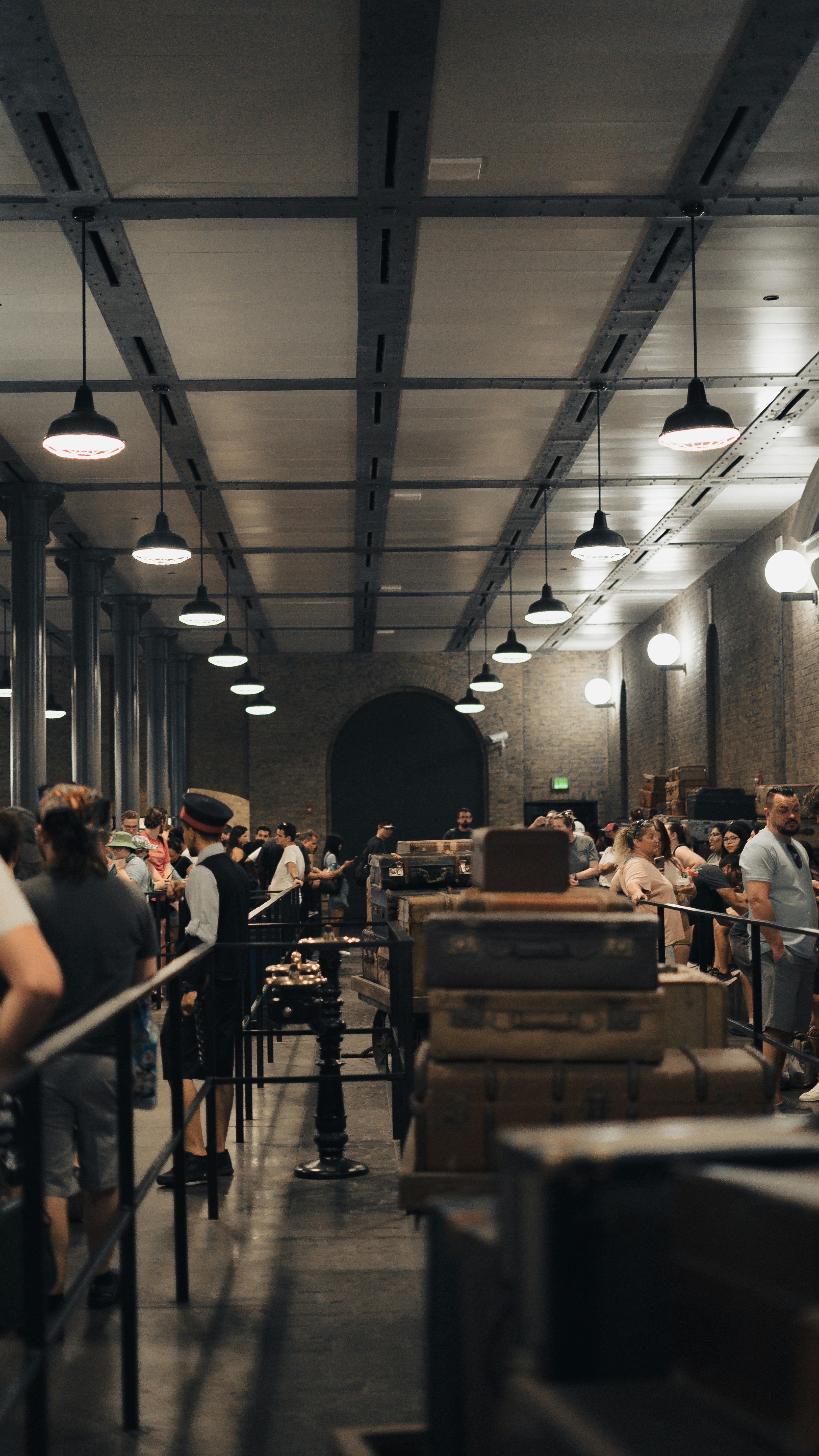 a group of people sitting at tables in a restaurant