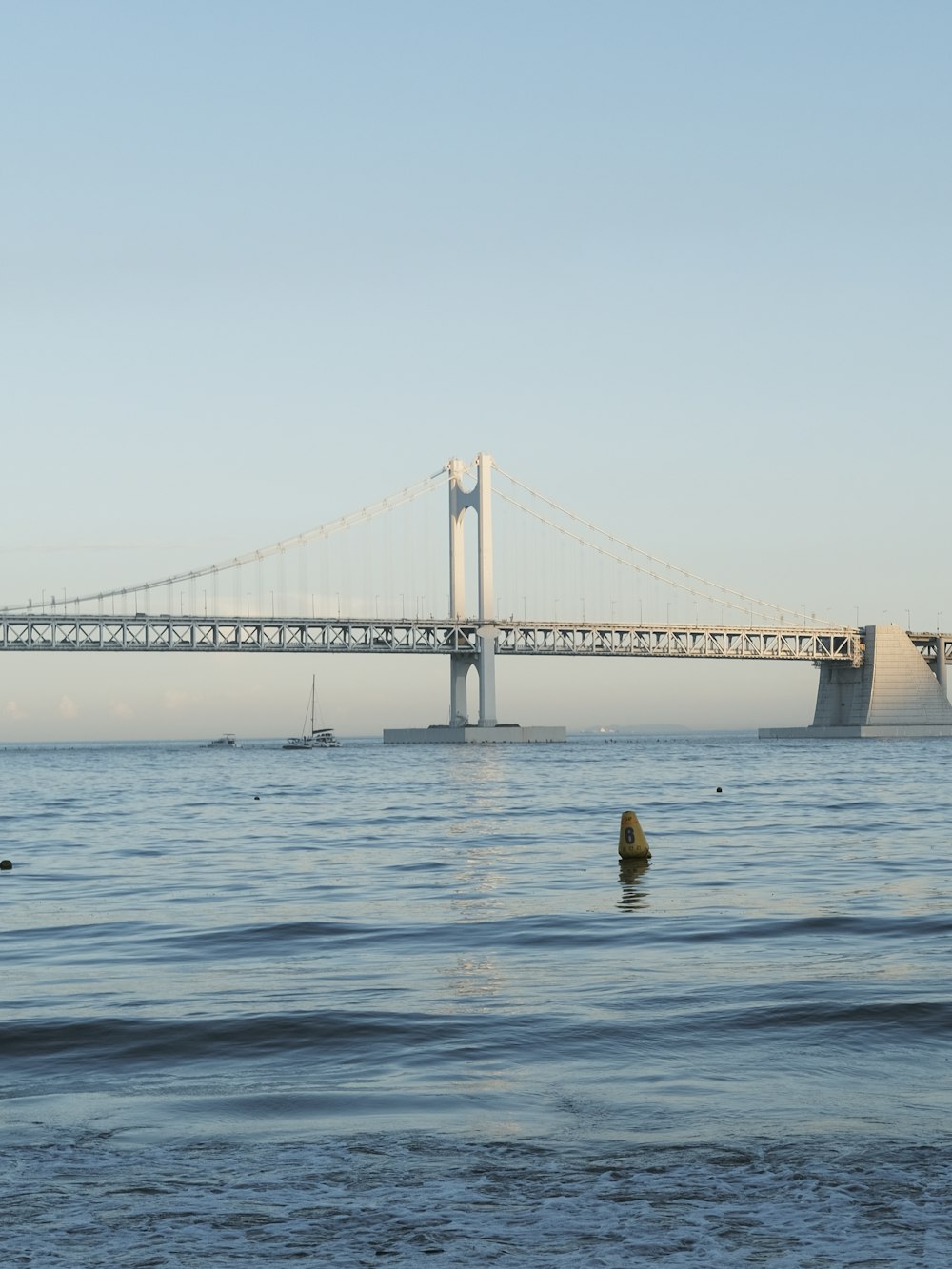 a large bridge spanning over a large body of water